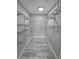 Large walk-in closet with wire shelving and wood grain tile floor at 21812 Edgewater Dr, Port Charlotte, FL 33952