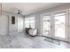 Bright living room with wood floors, light-colored walls, and a large glass door with a patio view at 21812 Edgewater Dr, Port Charlotte, FL 33952