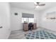 Office space with work desk, tile floors, bright natural lighting, and ceiling fan at 21812 Edgewater Dr, Port Charlotte, FL 33952
