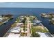 A waterfront house is displayed, showing its proximity to open water and other waterfront residences at 233 Beeney Se Rd, Port Charlotte, FL 33952