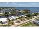 Waterfront property featuring lush greenery, showcasing easy access to the bay and surrounding waterfront residences at 233 Beeney Se Rd, Port Charlotte, FL 33952