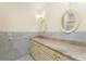 Bathroom with a large vanity, decorative mirrors, and tiled walls at 233 Beeney Se Rd, Port Charlotte, FL 33952