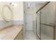 Bathroom with a glass door shower, neutral tile, and a wide vanity at 233 Beeney Se Rd, Port Charlotte, FL 33952