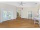 Spacious bedroom featuring hardwood floors and French doors to the patio at 233 Beeney Se Rd, Port Charlotte, FL 33952