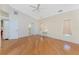 Bedroom boasting hardwood floors, vaulted ceilings, and neutral paint at 233 Beeney Se Rd, Port Charlotte, FL 33952