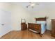 Bedroom with vintage wood furnishings, vaulted ceiling, and hardwood floors at 233 Beeney Se Rd, Port Charlotte, FL 33952