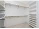 A walk-in closet featuring shelves and wire drawers for storage at 233 Beeney Se Rd, Port Charlotte, FL 33952