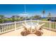 Outdoor deck with table and seating, perfect for enjoying the beautiful waterfront view at 233 Beeney Se Rd, Port Charlotte, FL 33952