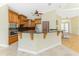 A stylish kitchen with stainless steel appliances, custom cabinetry, granite countertops, and elegant architectural details at 233 Beeney Se Rd, Port Charlotte, FL 33952