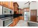 An upgraded kitchen featuring stainless steel appliances, custom cabinetry, granite countertops, and recessed lighting at 233 Beeney Se Rd, Port Charlotte, FL 33952
