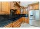 A well-equipped kitchen showcases stainless steel appliances, custom wood cabinets, and sleek granite countertops at 233 Beeney Se Rd, Port Charlotte, FL 33952