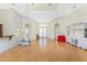 Expansive living room featuring hardwood floors, recessed lighting, and multiple doorways at 233 Beeney Se Rd, Port Charlotte, FL 33952