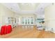 Open concept living room with hardwood floors, recessed lighting, and a seamless flow to other areas at 233 Beeney Se Rd, Port Charlotte, FL 33952