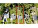 An aerial view of a property showcasing its layout, surrounding greenery, and neighborhood at 23476 Harper Ave, Punta Gorda, FL 33980