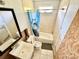 Bathroom needing upgrades, features a tub/shower, sink, and toilet at 23476 Harper Ave, Punta Gorda, FL 33980