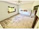 Renovations underway in this bedroom featuring tile floors, a ceiling fan, and natural light at 23476 Harper Ave, Punta Gorda, FL 33980
