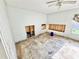 Bright, large bedroom with ceiling fan; a blank canvas for renovation and personalization at 23476 Harper Ave, Punta Gorda, FL 33980