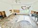 Spacious bedroom awaiting renovation, featuring a ceiling fan and natural light at 23476 Harper Ave, Punta Gorda, FL 33980