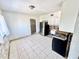 Kitchen featuring stainless steel appliances and white cabinetry, in need of renovation at 23476 Harper Ave, Punta Gorda, FL 33980