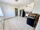 Kitchen featuring stainless steel appliances and white cabinetry, in need of renovation at 23476 Harper Ave, Punta Gorda, FL 33980