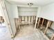 Open room showing exposed wall studs ready for customizing this home space at 23476 Harper Ave, Punta Gorda, FL 33980
