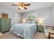 Cozy bedroom with a ceiling fan and coordinated furniture offers a relaxing atmosphere at 26177 Madras Ct, Punta Gorda, FL 33983