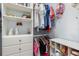 Organized walk-in closet with shelving, drawers, and rods for hanging clothes at 26177 Madras Ct, Punta Gorda, FL 33983