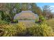 Deep Creek community entrance sign surrounded by lush landscaping and colorful flowers at 26177 Madras Ct, Punta Gorda, FL 33983
