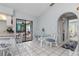 Dining area boasts tile flooring and access to both the kitchen and screened-in lanai at 26177 Madras Ct, Punta Gorda, FL 33983
