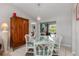 Bright dining room with seating for six and a view of the outdoor pool area at 26177 Madras Ct, Punta Gorda, FL 33983