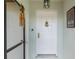 Inviting front entrance with decorative door details, hardware, and secure video doorbell at 26177 Madras Ct, Punta Gorda, FL 33983