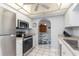 Efficient kitchen with updated appliances, sleek countertops, and easy access to the dining area at 26177 Madras Ct, Punta Gorda, FL 33983