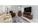 Cozy living room with tile floors, comfortable seating, and neutral paint at 26177 Madras Ct, Punta Gorda, FL 33983