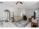 Bright living room features tile flooring, comfortable seating, neutral paint, and a decorative rug at 26177 Madras Ct, Punta Gorda, FL 33983