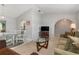 Open-concept living area with seamless transition to dining space and arched doorways at 26177 Madras Ct, Punta Gorda, FL 33983
