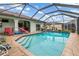 Sparkling pool within a screened enclosure, perfect for relaxation and outdoor enjoyment at 26177 Madras Ct, Punta Gorda, FL 33983