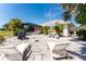 This backyard features a screened-in pool, seating, grill, and lounge chairs at 279 Mariner Ln, Rotonda West, FL 33947