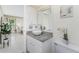 Bright bathroom featuring a granite countertop, a vessel sink, and ample cabinet space at 279 Mariner Ln, Rotonda West, FL 33947