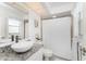 Stylish bathroom featuring white tiling, granite countertop, vessel sink, and modern fixtures at 279 Mariner Ln, Rotonda West, FL 33947