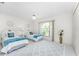 Charming bedroom with twin beds, tile flooring, ceiling fan, and window views at 279 Mariner Ln, Rotonda West, FL 33947