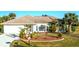 Attractive single-story home with well-manicured landscaping and a charming front yard at 279 Mariner Ln, Rotonda West, FL 33947