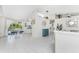Open-concept space showcasing the dining area adjacent to the living room with white tile flooring at 279 Mariner Ln, Rotonda West, FL 33947