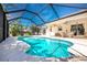 Serene pool area with a screened enclosure, perfect for enjoying a swim in a private setting at 279 Mariner Ln, Rotonda West, FL 33947