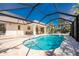 Relaxing pool area with a screened enclosure and ample deck space, ideal for outdoor enjoyment at 279 Mariner Ln, Rotonda West, FL 33947