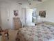 A bright bedroom with a queen bed, dresser, and ample closet space offers a comfortable and inviting retreat at 4056 Oakview Dr # E10, Port Charlotte, FL 33980