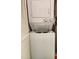 A stacked washer and dryer unit, conveniently located near the bedrooms for easy laundry access at 4056 Oakview Dr # E10, Port Charlotte, FL 33980
