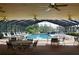 Enclosed community pool featuring seating and ceiling fans in a well maintained space at 4056 Oakview Dr # E10, Port Charlotte, FL 33980