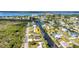 Aerial view of home located on canal in established neighborhood at 4231 Hollis Ave, Port Charlotte, FL 33953