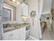 Bathroom vanity with granite countertop, stylish mirror, and additional features at 4231 Hollis Ave, Port Charlotte, FL 33953