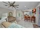 Open floor plan with tile floors, neutral decor, a ceiling fan, and a combined living/bedroom area at 4231 Hollis Ave, Port Charlotte, FL 33953